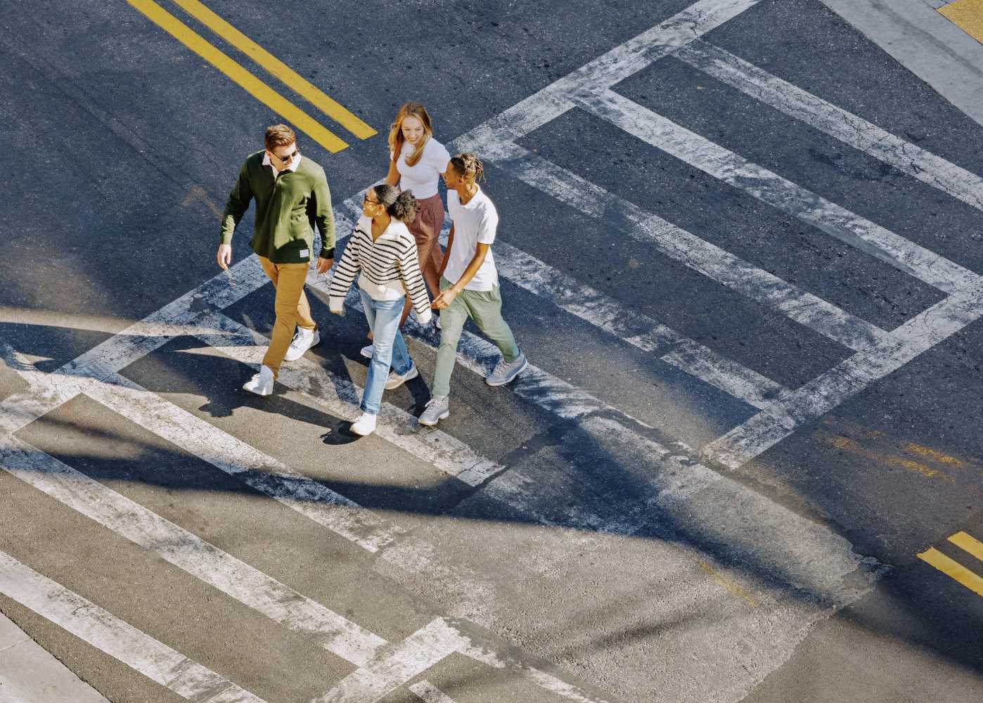 A group of friends using a crosswalk