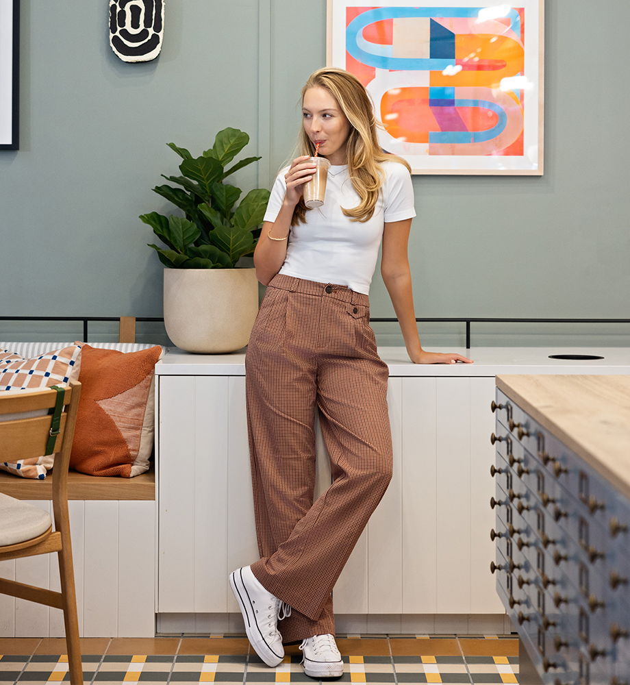 A woman drinking a cup of coffee